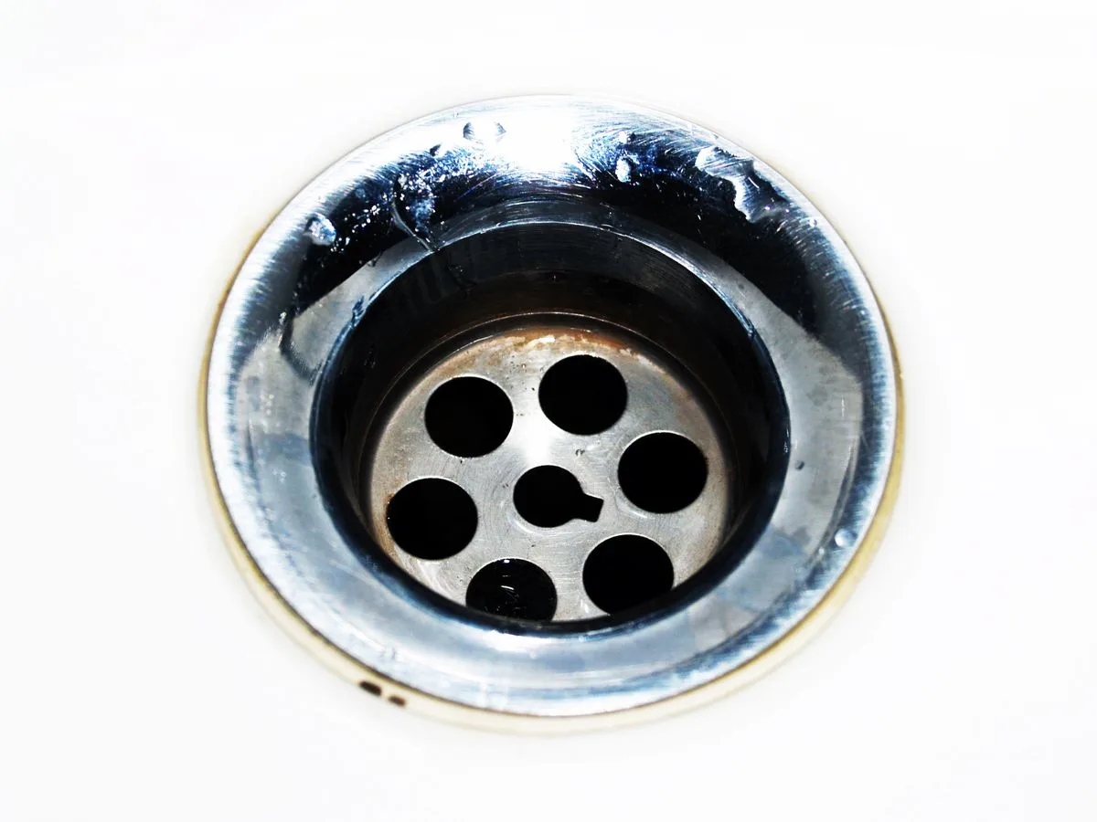 Stainless steel sink drain representing drain cleaning services in Rapid City, SD