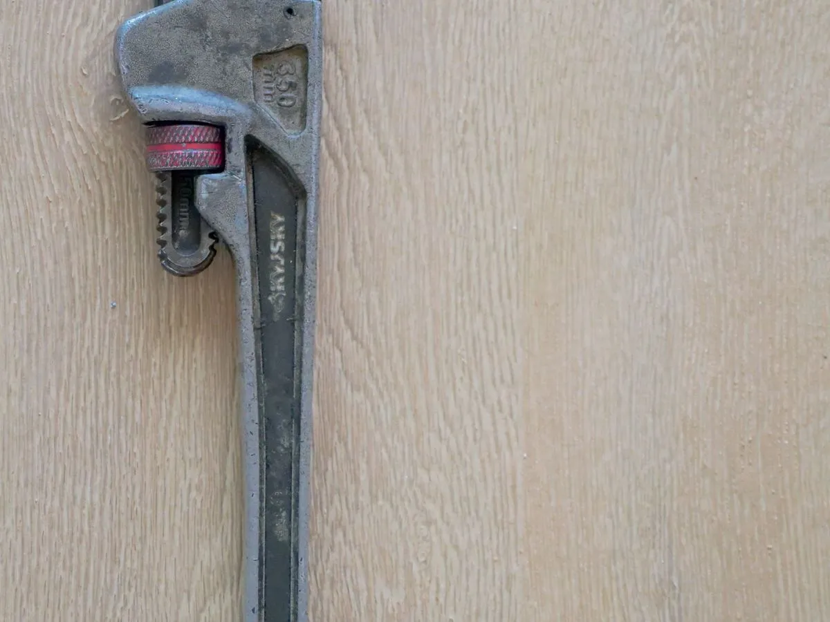 Pipe wrench, a standard tool used for professional plumbing repairs